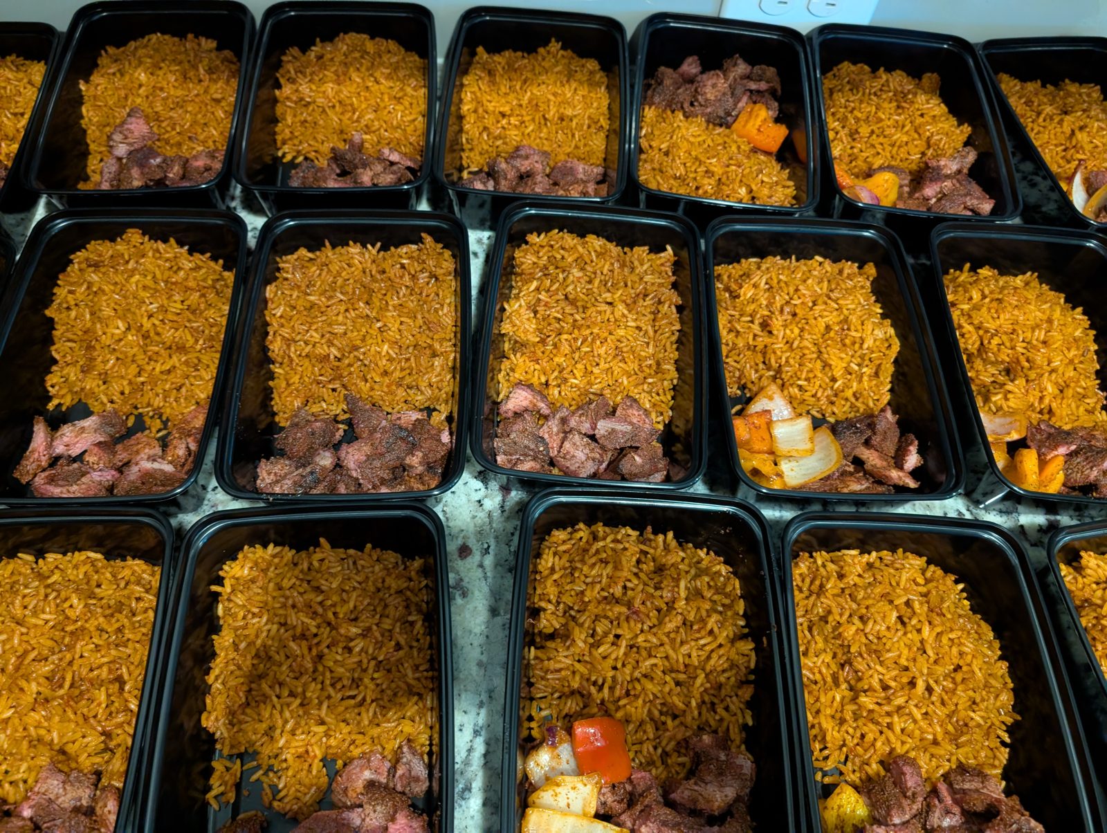 Wood-fired signature jollof rice